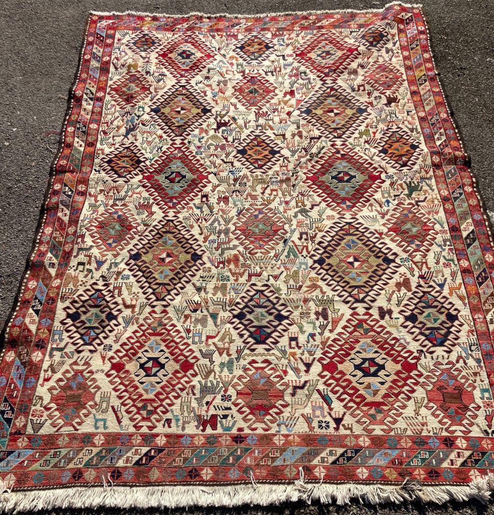 A Caucasian geometric ivory carpet, 290 x 213cm